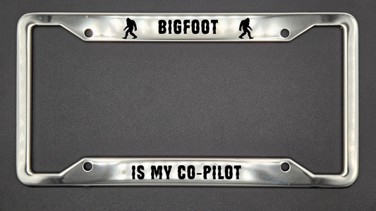 Bigfoot is my Co-Pilot - Stainless Steel License Plate Frame - Bigfoot Bigheart Studio