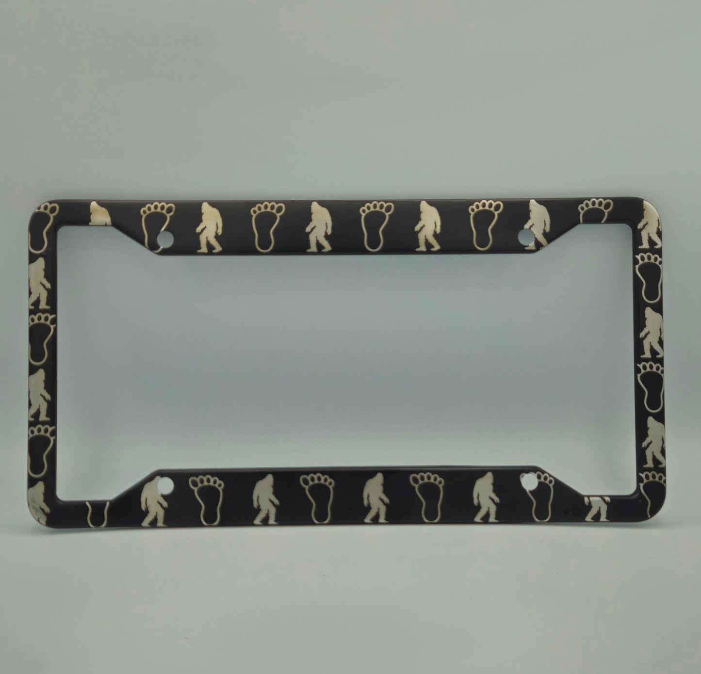 Bigfoot and Footprints - Metal License Plate Frame